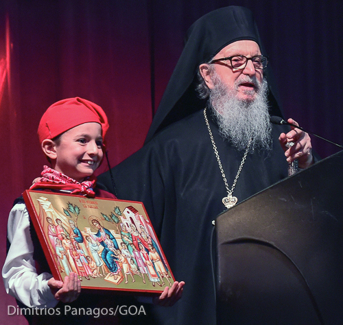 Archbishop Demetrios received the Metropolitan Anthony Humanitarian Award 2016.  A young boy, Christian, presents a portable icon of "Christ Blessing the Children" to His Eminence.